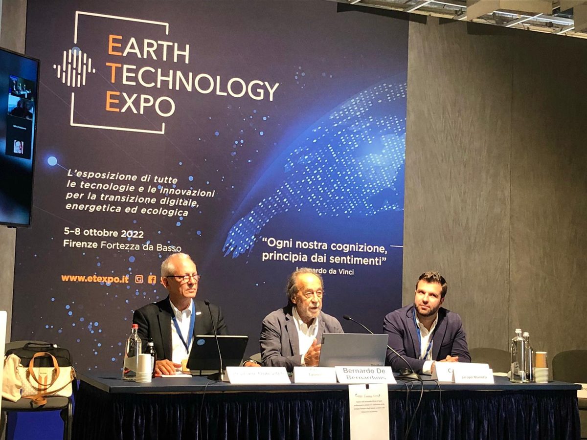 Jacopo Manotti seated on a panel in front of the Earth Technology Expo backdrop